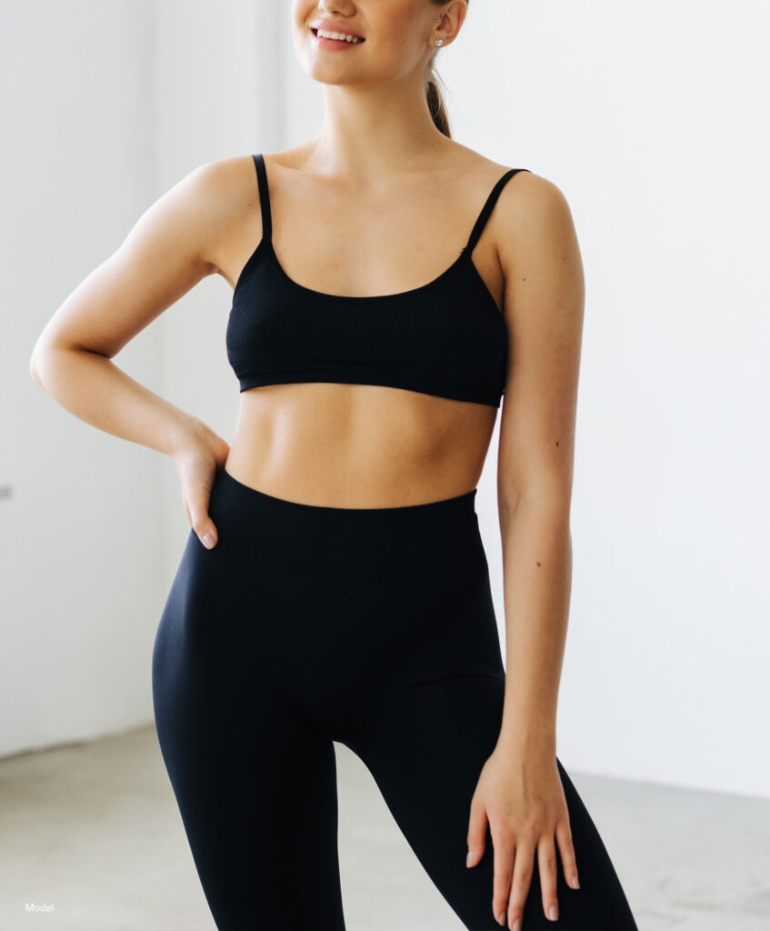 Curvy woman in black workout gear