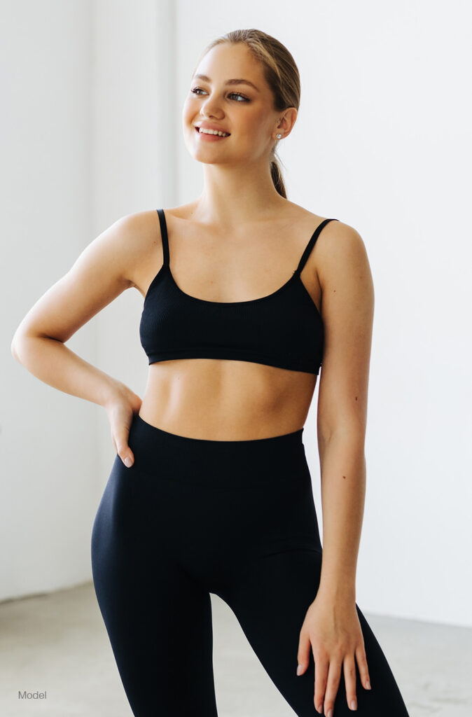 Curvy woman in black workout gear